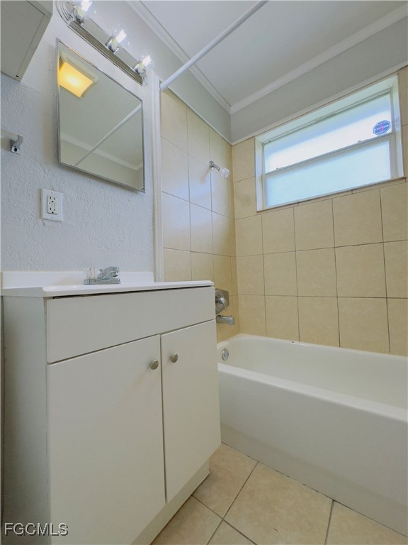 913 Hudson Avenue Lehigh Acres, FL 33936 - Photo 25 of 36 a bathroom with a bathtub and a sink