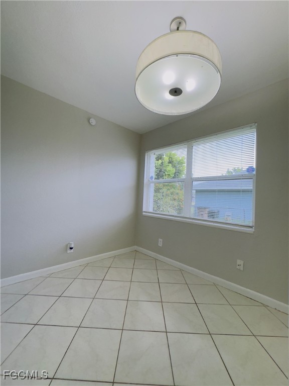 913 Hudson Avenue Lehigh Acres, FL 33936 - Photo 28 of 36 an empty room with windows