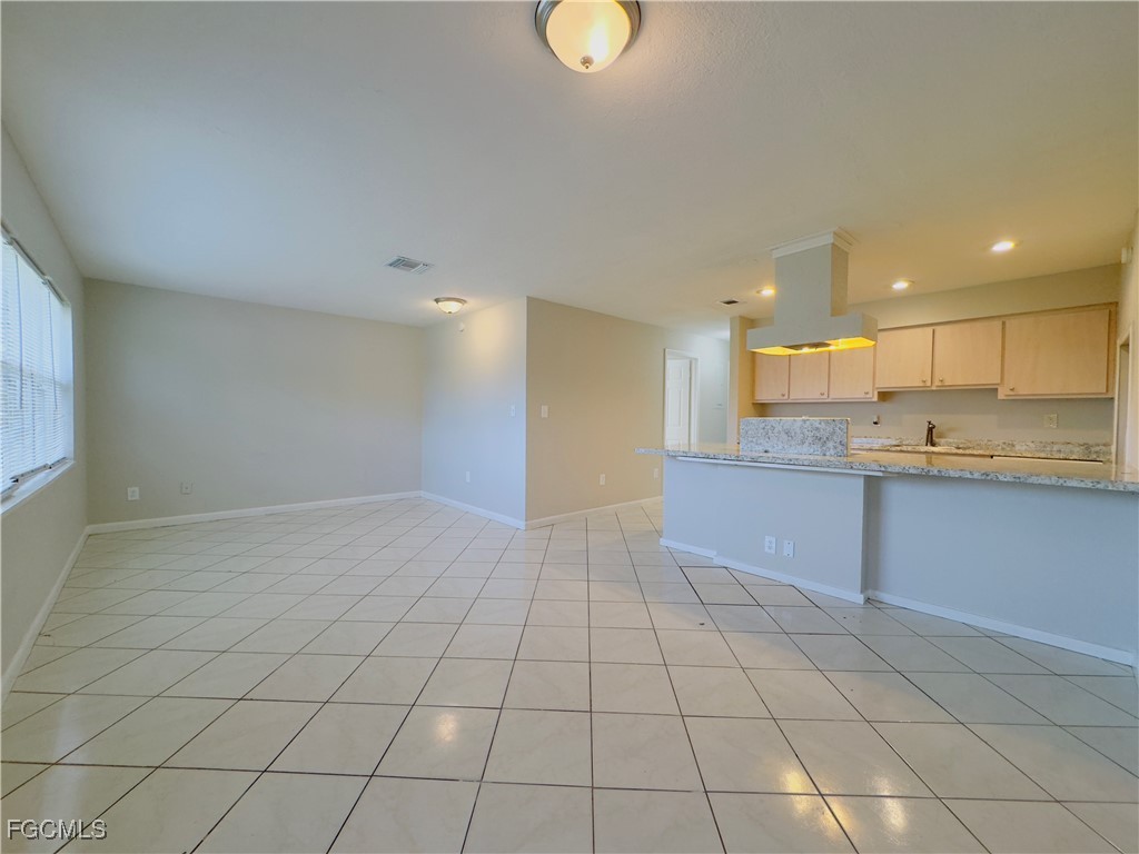 913 Hudson Avenue Lehigh Acres, FL 33936 - Photo 4 of 36 a view of a kitchen with a sink and cabinets
