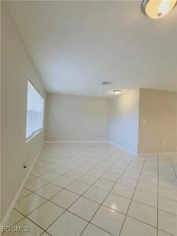 a view of an empty room and window