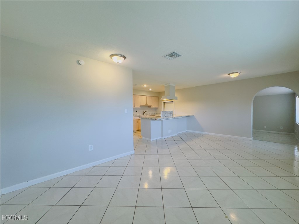 913 Hudson Avenue Lehigh Acres, FL 33936 - Photo 6 of 36 a view of a livingroom with a dishwasher and a microwave