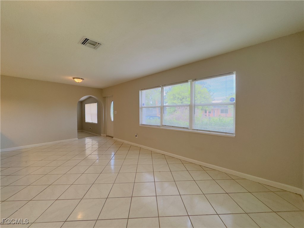 913 Hudson Avenue Lehigh Acres, FL 33936 - Photo 7 of 36 a view of an empty room and window