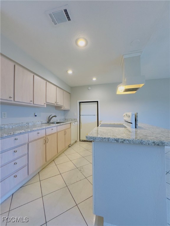 913 Hudson Avenue Lehigh Acres, FL 33936 - Photo 9 of 36 a kitchen with a sink and cabinets