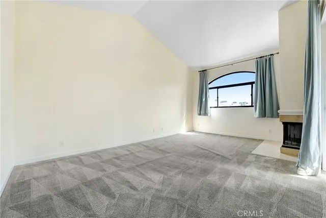 a spacious bathroom with a granite countertop sink mirror and bathtub