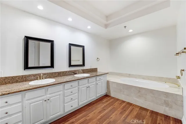 swimming pool view with a seating space and a garden view