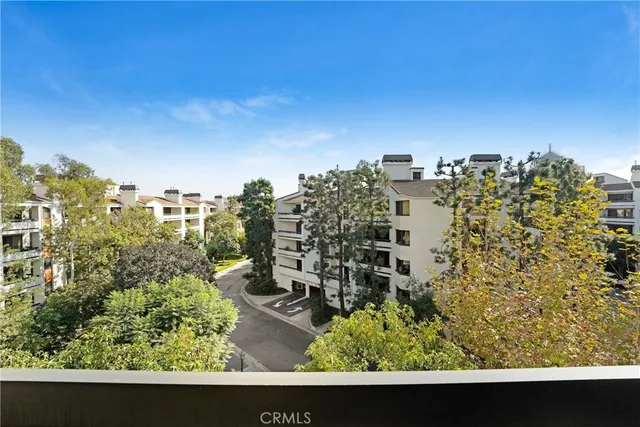 a living room with furniture a flat screen tv and a large window