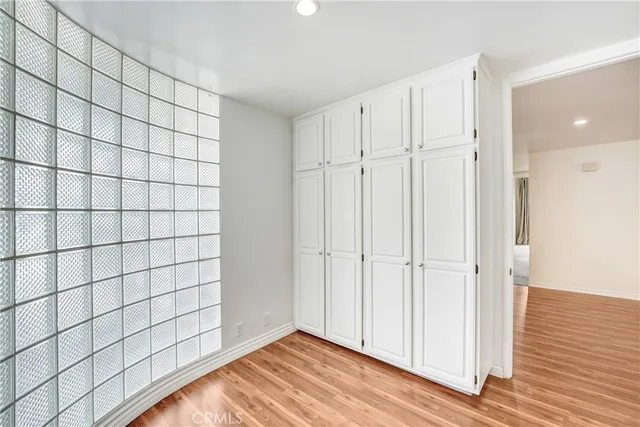 a bathroom with a granite countertop sink a toilet and mirror