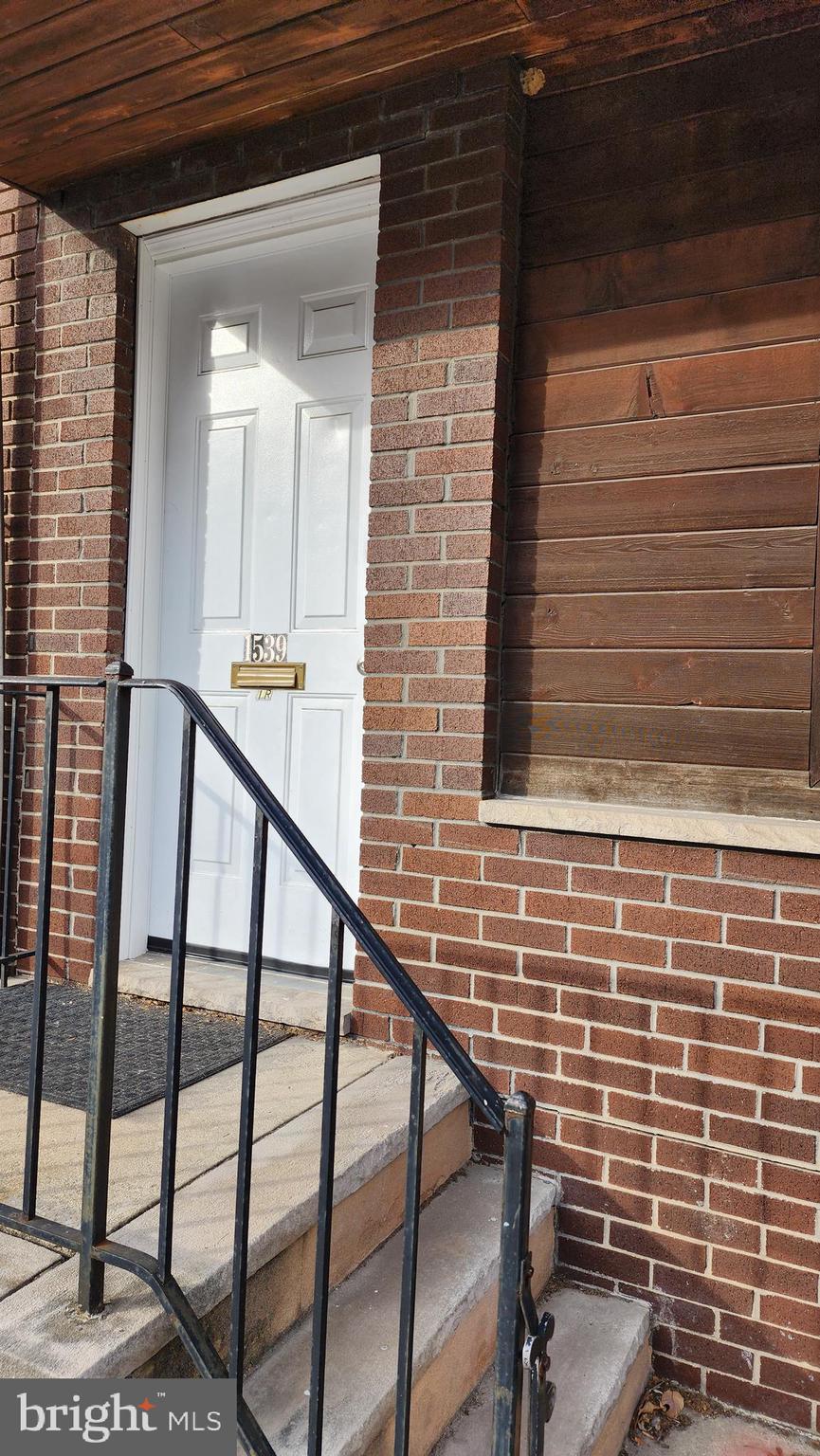 1539 East Moyamensing Avenue, Unit 1R Philadelphia, PA 19147 - Photo 2 of 7 a view of staircase with railing and white walls