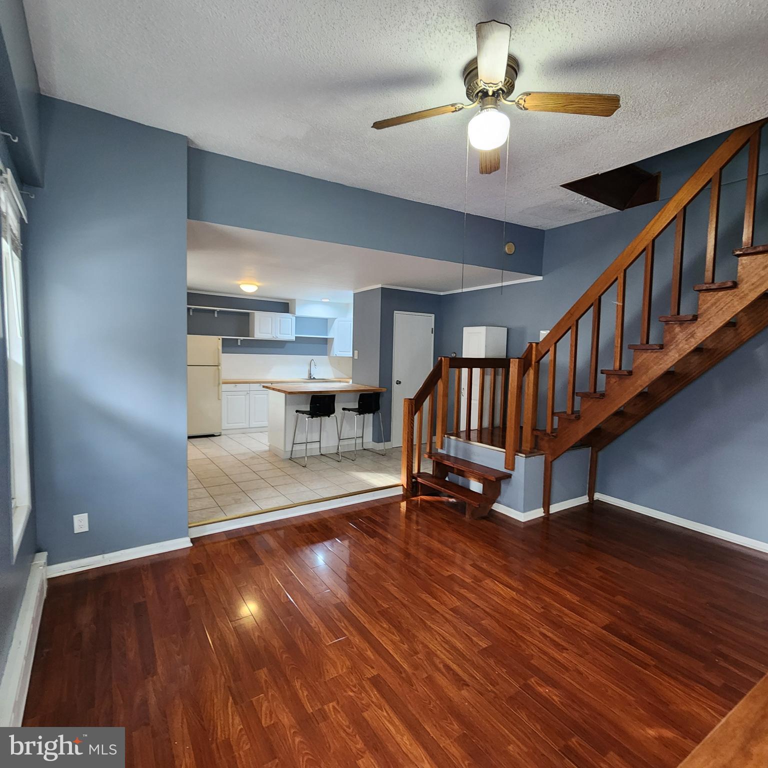 1539 East Moyamensing Avenue, Unit 1R Philadelphia, PA 19147 - Photo 5 of 7 a view of an empty room with a window and wooden floor