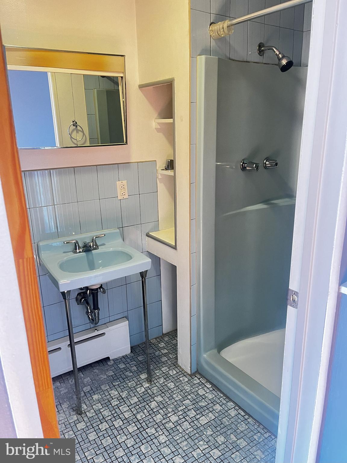 1539 East Moyamensing Avenue, Unit 1R Philadelphia, PA 19147 - Photo 7 of 7 a bathroom with a sink and a mirror