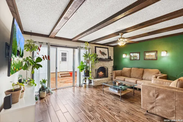 a living room with furniture and a fireplace