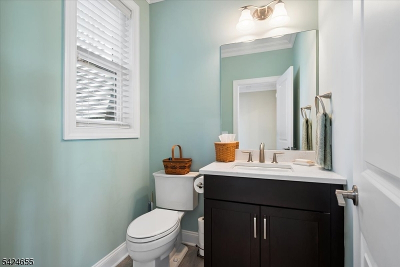 401 Mariners Pointe Hopatcong, NJ 07843 - Photo 22 of 42 a bathroom with a toilet a sink and mirror