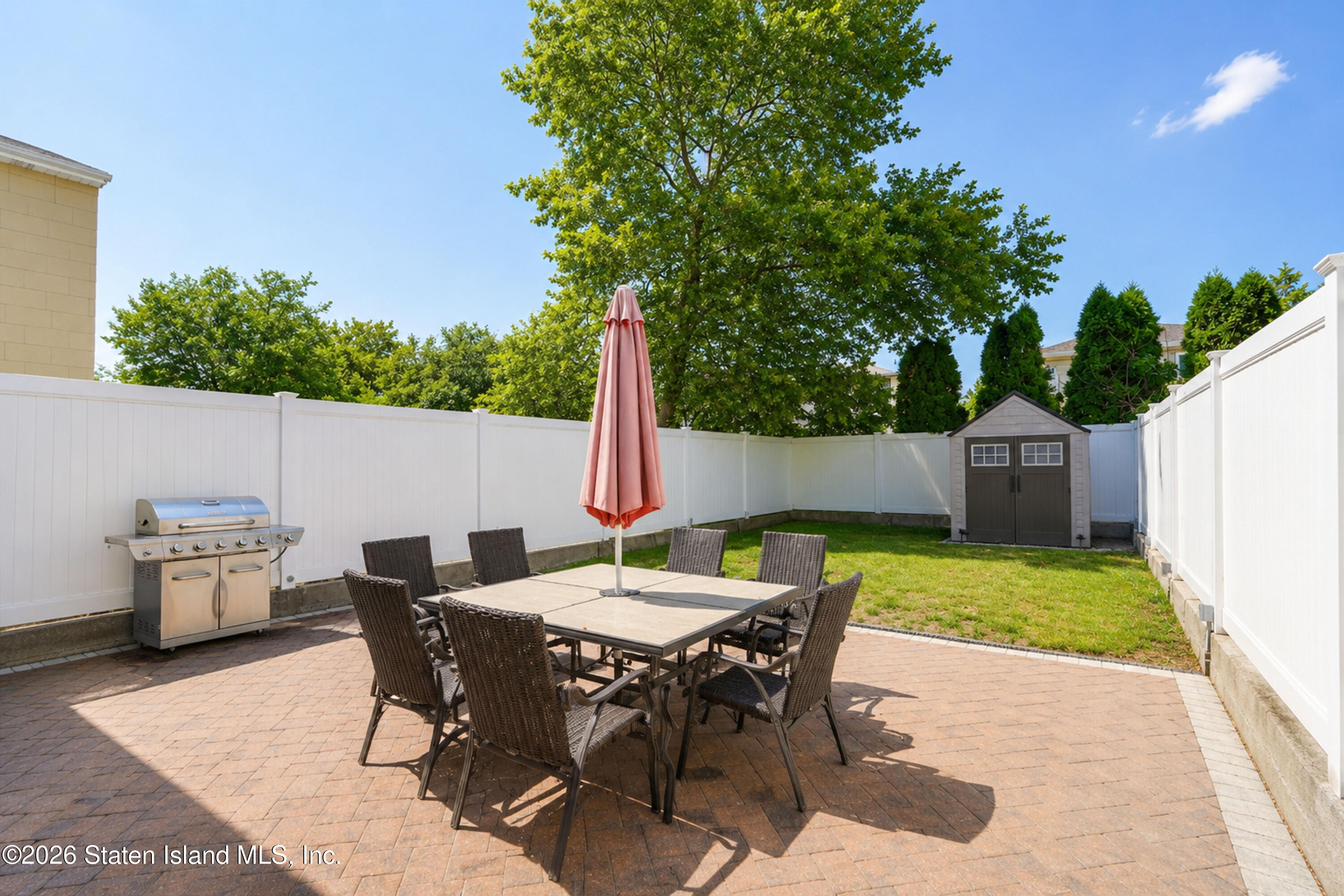 37 Middle Loop Road Staten Island, NY 10308 - Photo 36 of 38 a view of a backyard with furniture and a garden