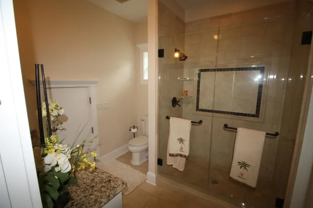 a view of a dining room with furniture and a chandelier