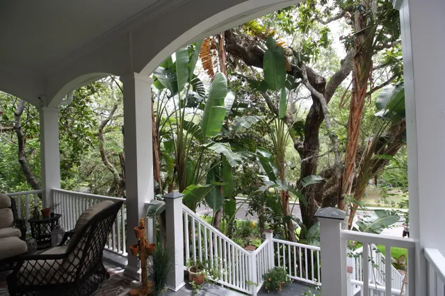 a view of a balcony with chairs