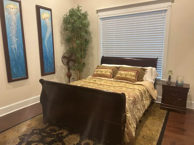 a view of a patio with table and chairs and potted plants