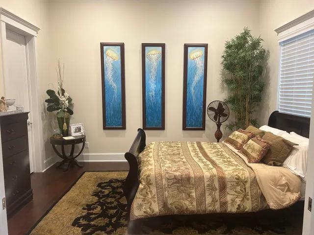 a view of house with backyard and sitting area