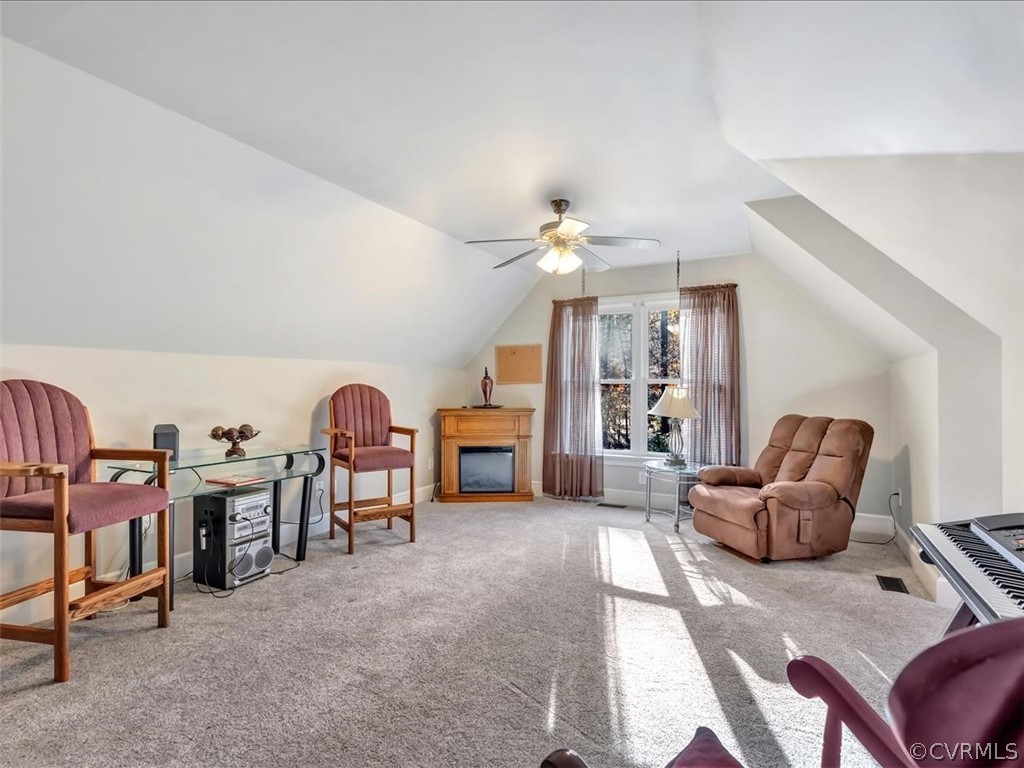 12641 2nd Branch Road Chesterfield, VA 23838 - Photo 30 of 40 a living room with furniture and a chandelier