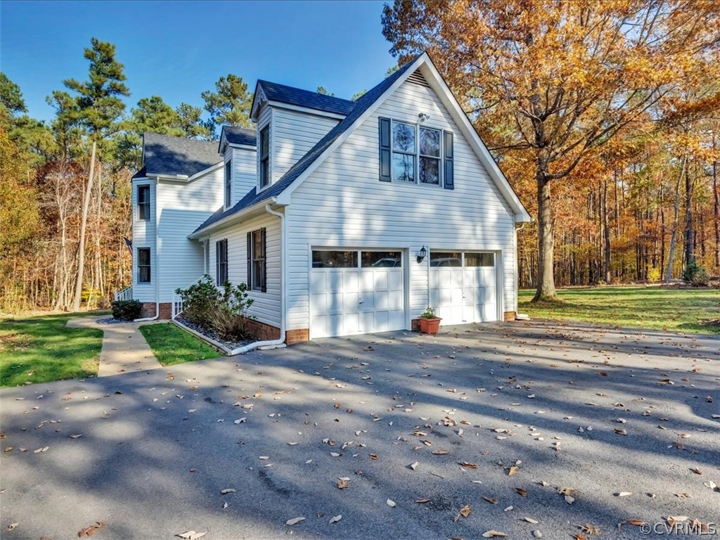 12641 2nd Branch Road Chesterfield, VA 23838 - Photo 4 of 40 a front view of a house with a yard