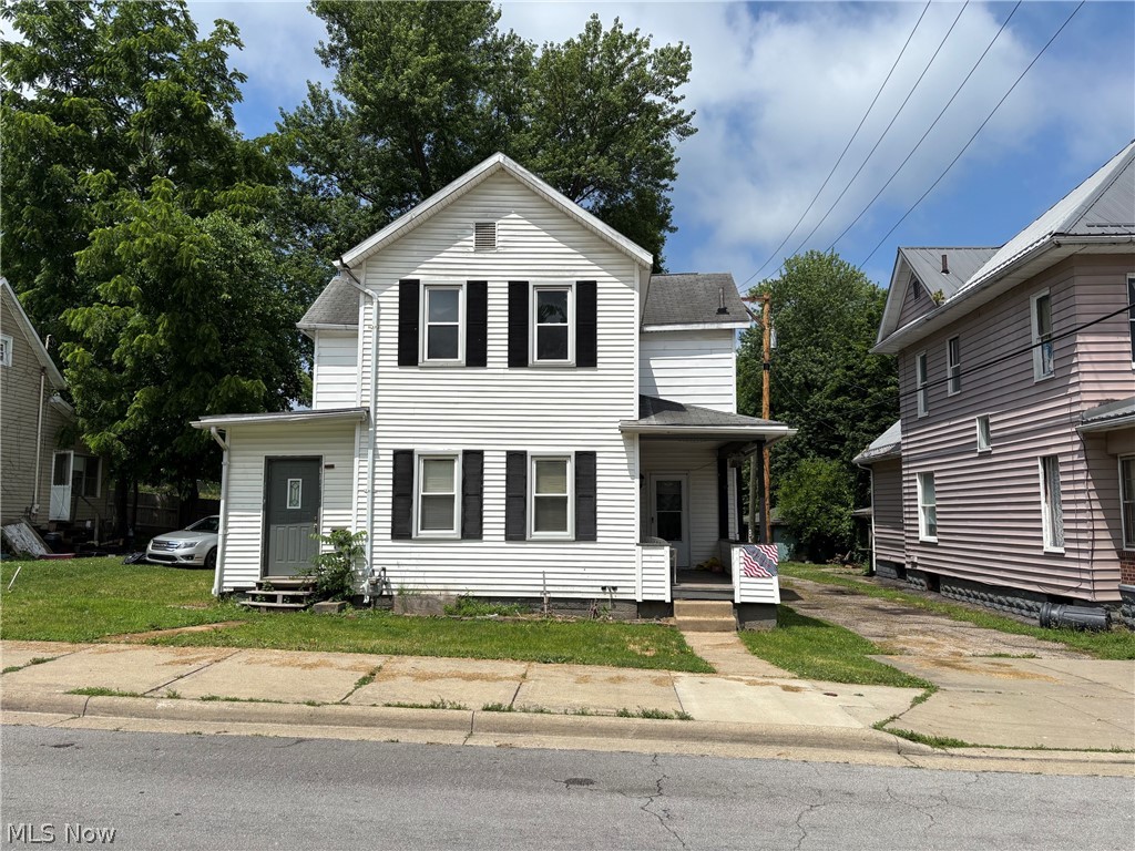 313 North 8th Street Cambridge, OH 43725 - Photo 1 of 1 Two-story residence featuring white siding and black window shutters