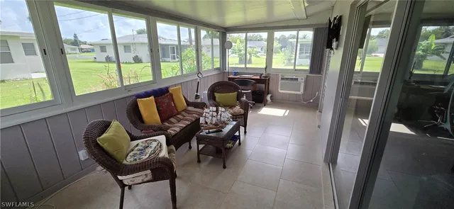 a view of a dining room with furniture window and outside view