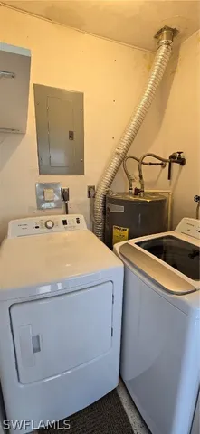 a utility room with washer and dryer