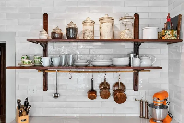 a view of a kitchen with a sink and windows