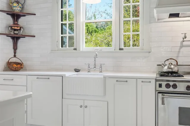 a view of a hallway with wooden floor and a bookshelf