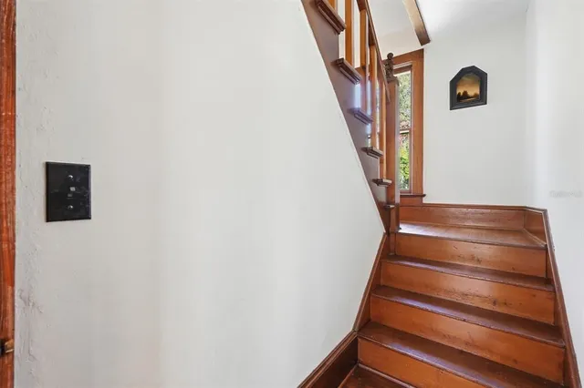 a view of a field with a tree in the background