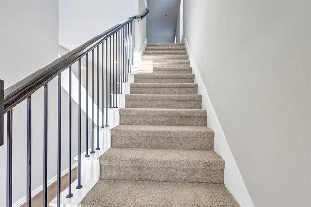 a view of staircase with white walls and white walls