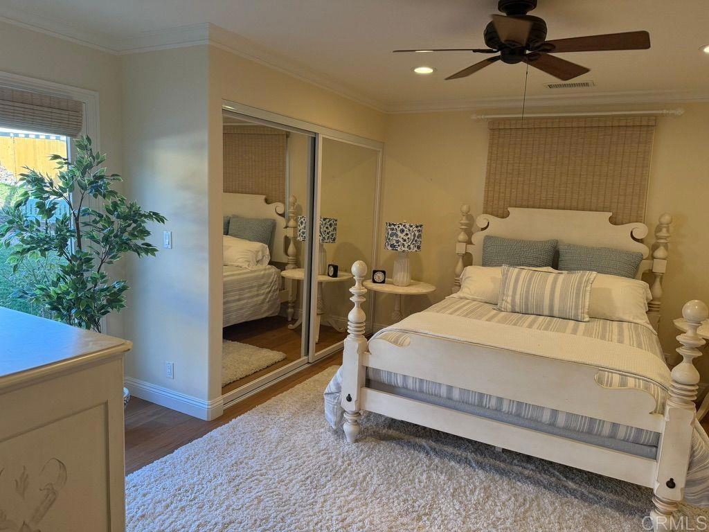 234 Winterhawk Lane Encinitas, CA 92024 - Photo 12 of 20 a bedroom with a bed and a potted plant