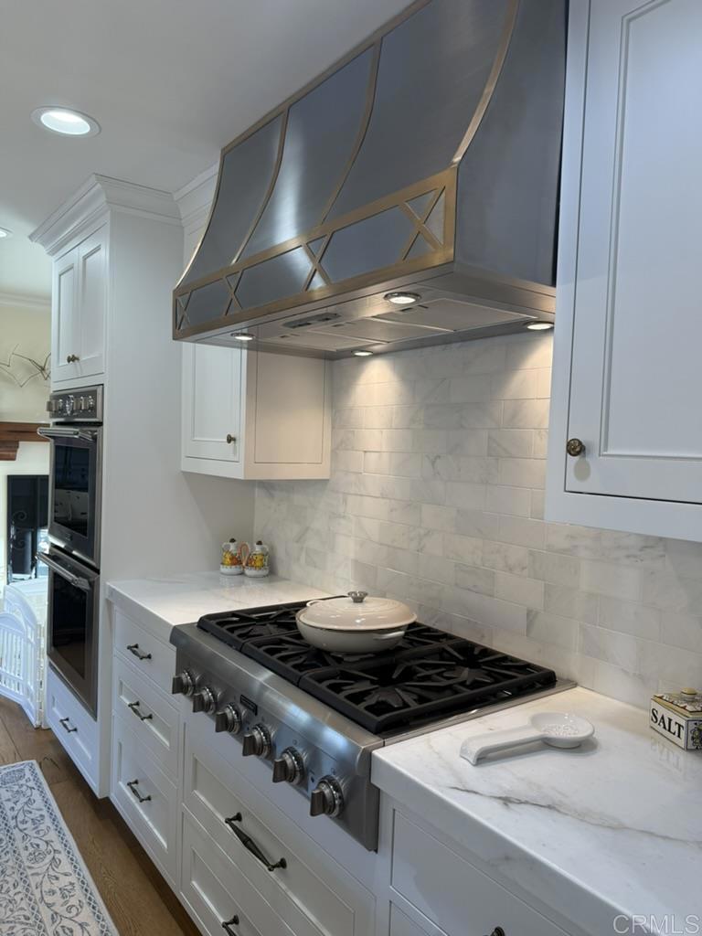 234 Winterhawk Lane Encinitas, CA 92024 - Photo 6 of 20 a stove top oven sitting inside of a kitchen