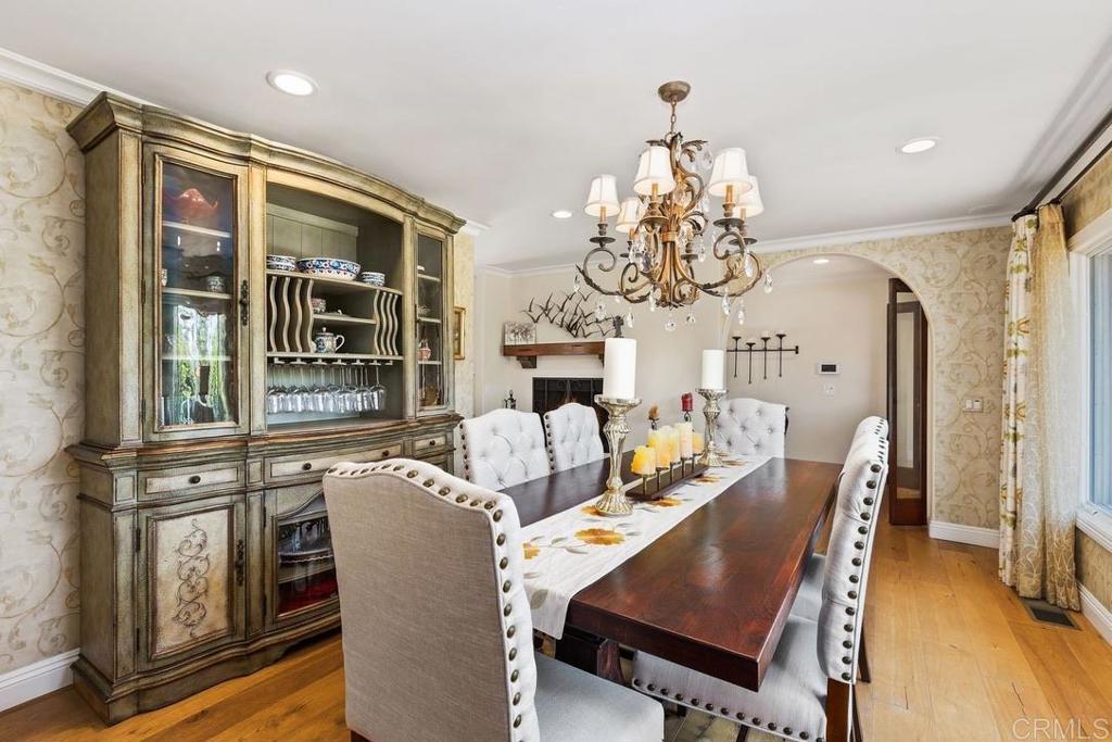234 Winterhawk Lane Encinitas, CA 92024 - Photo 7 of 20 a view of a dining room with furniture wooden floor and chandelier