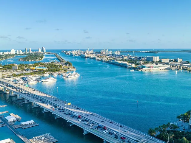 a view of a tree with a wooden wall