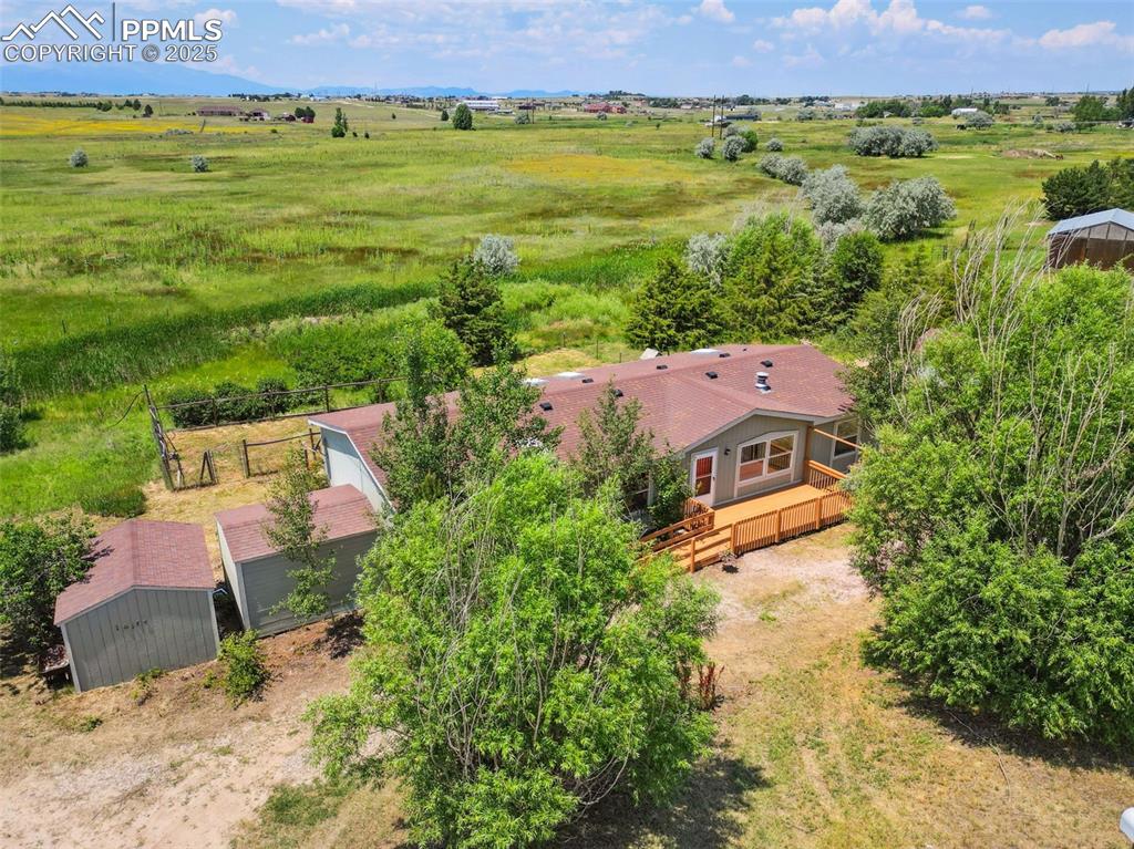 16175 Cathys Loop Peyton, CO 80831 - Photo 2 of 35 an aerial view of a house with a garden