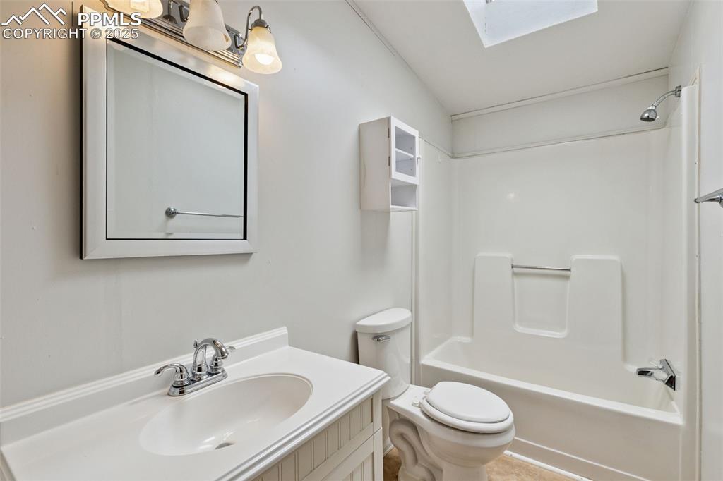 16175 Cathys Loop Peyton, CO 80831 - Photo 27 of 35 a bathroom with a sink a toilet and shower