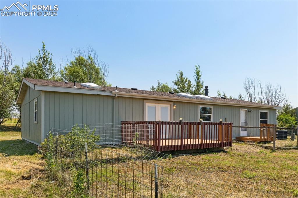 16175 Cathys Loop Peyton, CO 80831 - Photo 31 of 35 a view of a house with a balcony