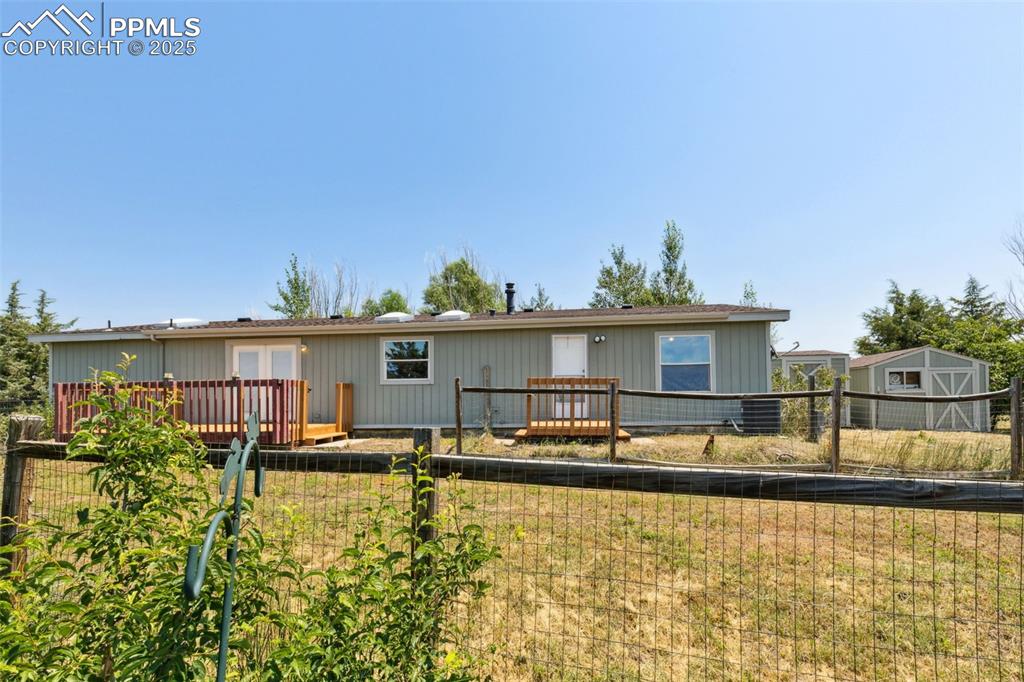16175 Cathys Loop Peyton, CO 80831 - Photo 33 of 35 a swimming pool view with a outdoor seating