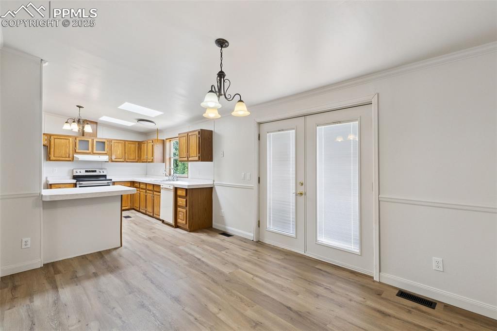 16175 Cathys Loop Peyton, CO 80831 - Photo 10 of 35 a view of a kitchen and dining room