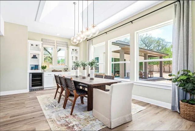 a view of a dining room with furniture window and wooden floor