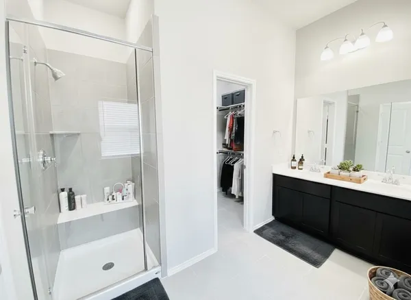 a bathroom with a sink and shower