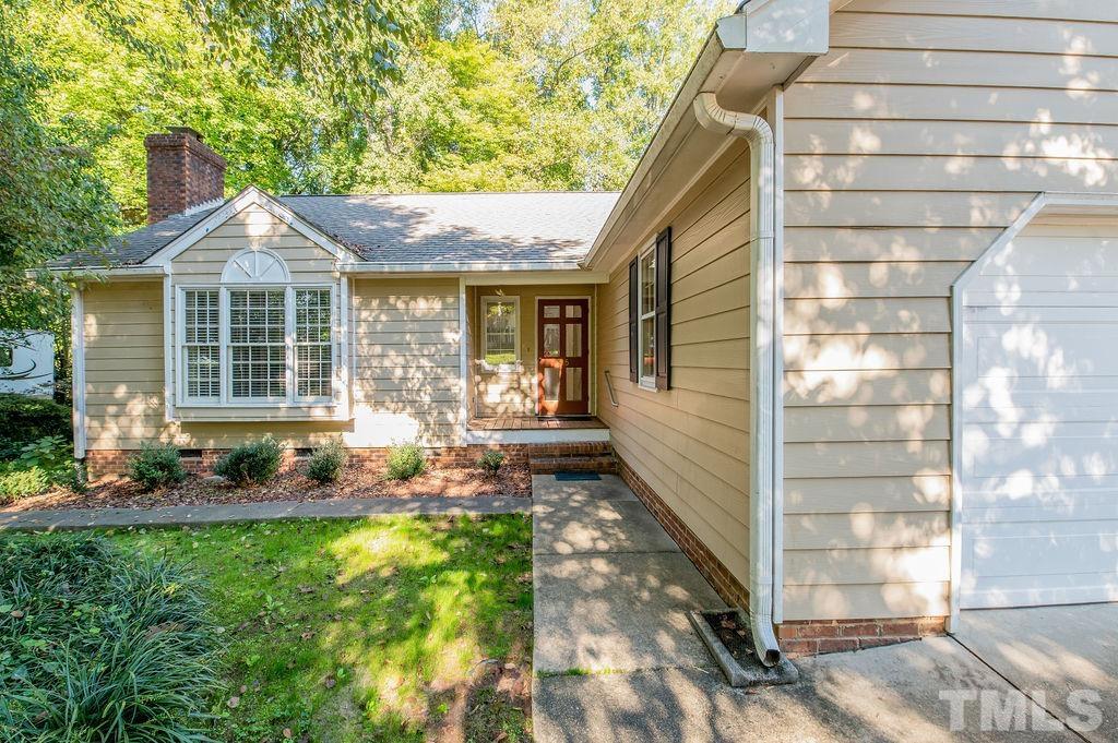 215 Lawrence Road Cary, NC 27511 - Photo 2 of 28 a front view of a house with garden