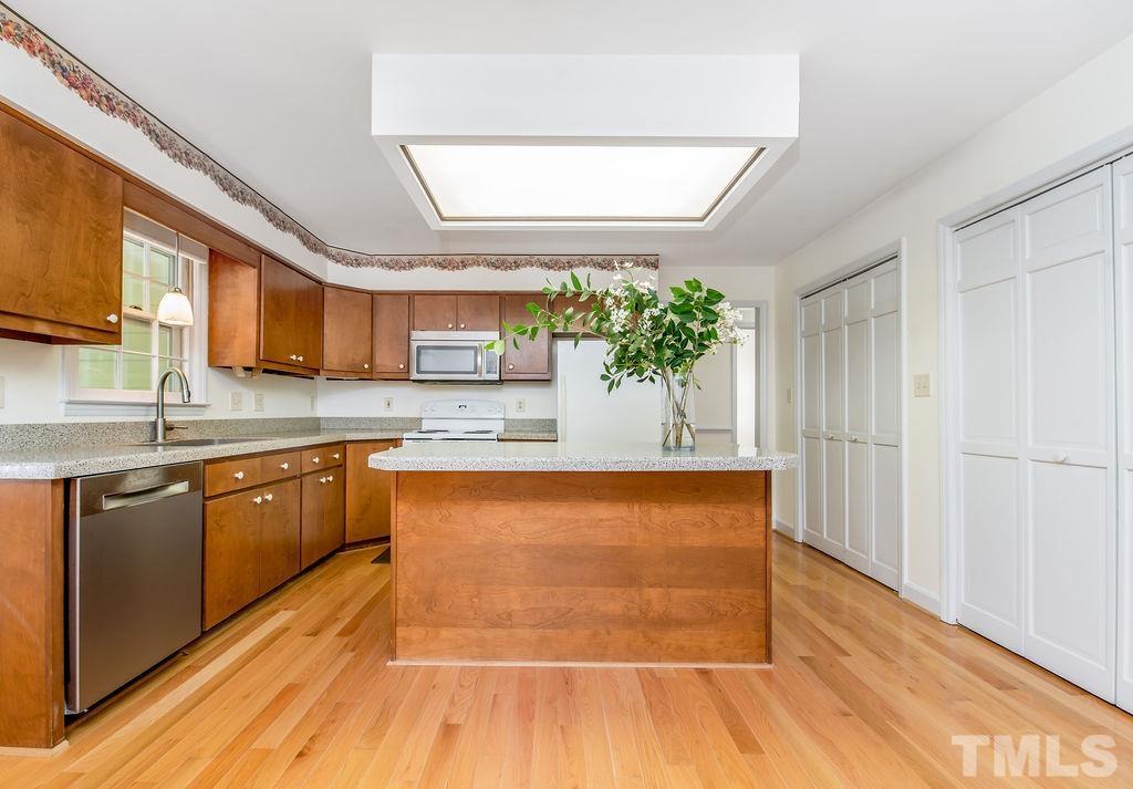 215 Lawrence Road Cary, NC 27511 - Photo 11 of 28 a large white kitchen with a large window