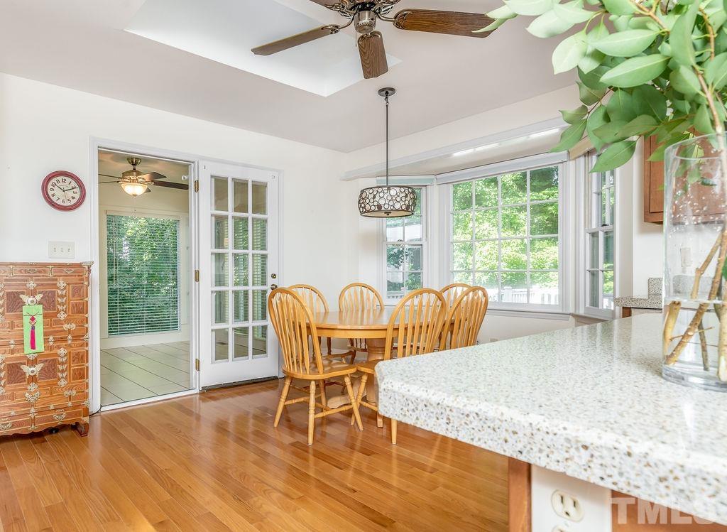 215 Lawrence Road Cary, NC 27511 - Photo 14 of 28 a dining room with furniture a chandelier and wooden floor