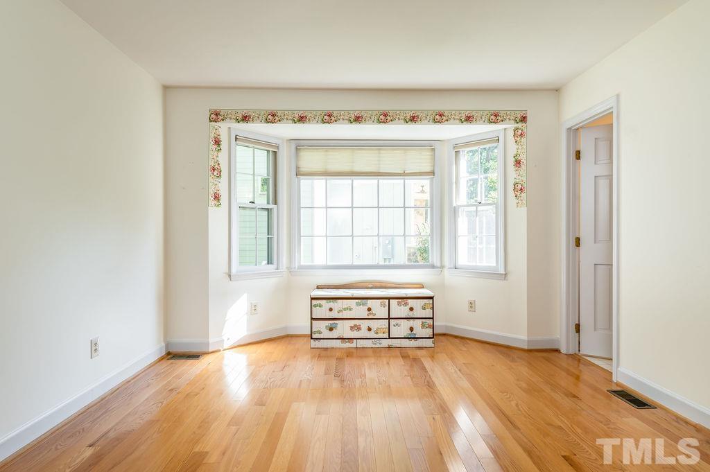 215 Lawrence Road Cary, NC 27511 - Photo 18 of 28 a view of an empty room with a window