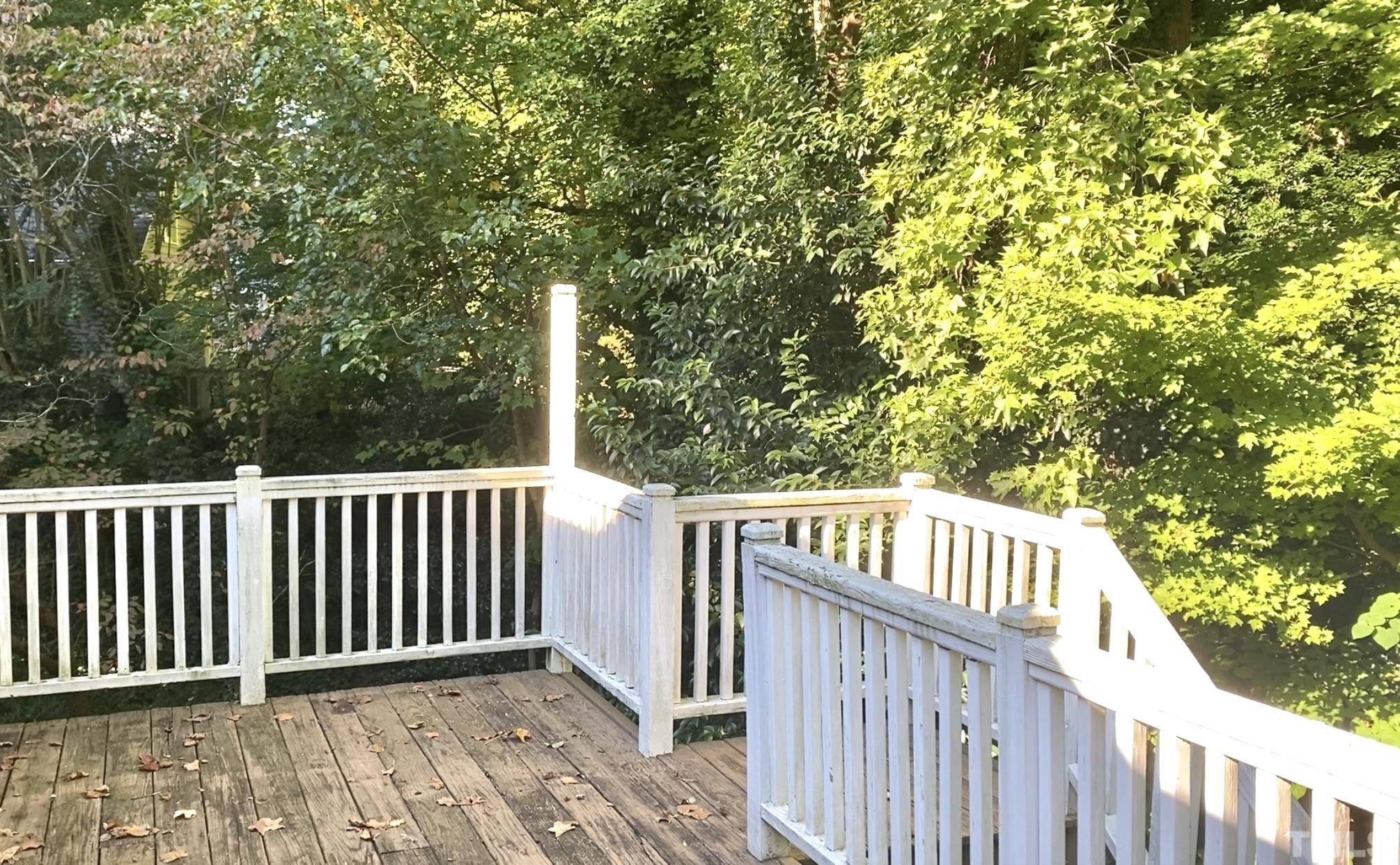 215 Lawrence Road Cary, NC 27511 - Photo 27 of 28 a view of deck with wooden floor and fence