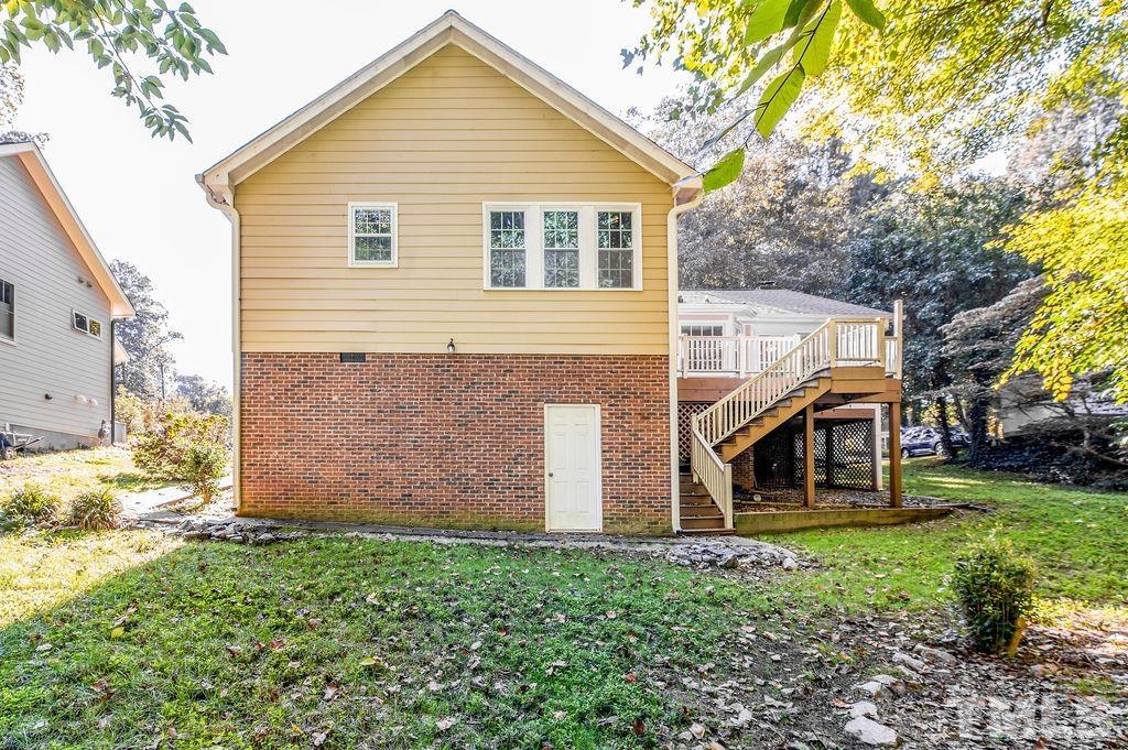 215 Lawrence Road Cary, NC 27511 - Photo 28 of 28 a view of a house with a yard