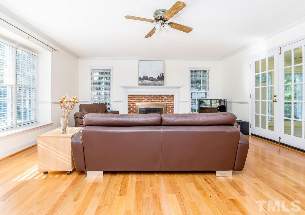 215 Lawrence Road Cary, NC 27511 - Photo 4 of 28 a living room with furniture and a fireplace