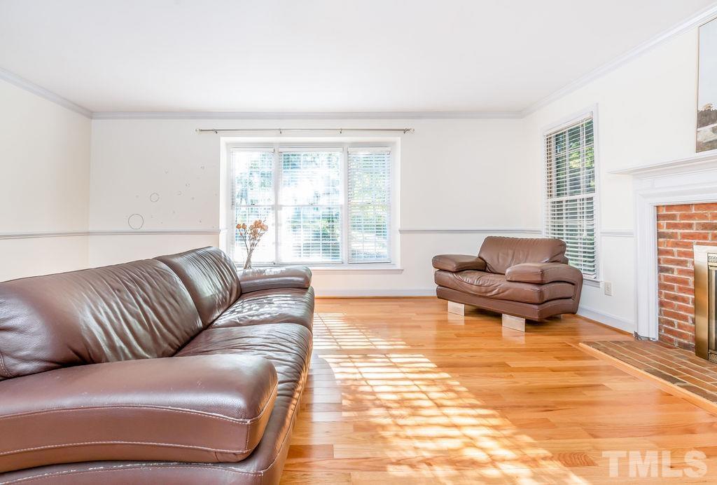 215 Lawrence Road Cary, NC 27511 - Photo 5 of 28 a living room with furniture and a large window