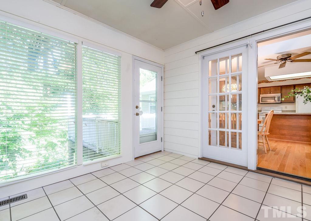 215 Lawrence Road Cary, NC 27511 - Photo 8 of 28 a view of empty room with windows